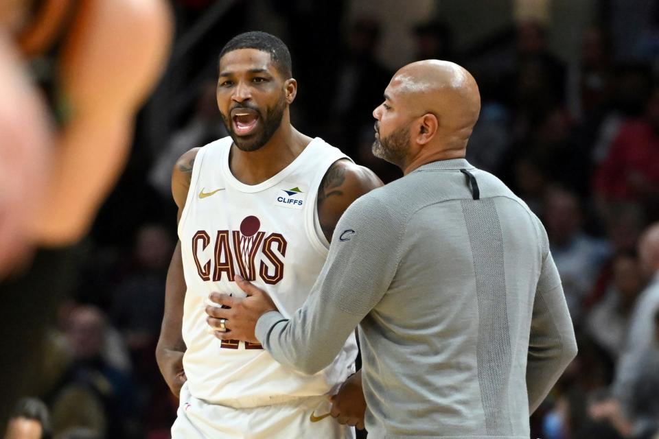 Cleveland Cavaliers' Tristan Thompson, left, is held back by coach J.B. Bickerstaff after Thompson was called for a technical foul against the Washington Wizards on Friday in Cleveland.