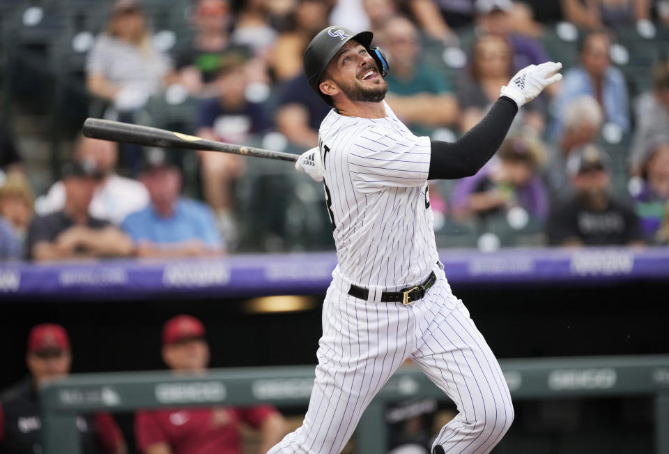 Colorado Rockies' Kris Bryant watches his single off Arizona Diamondbacks starting pitcher Merrill Kelly during the first inning of a baseball game Friday, July 1, 2022, in Denver. (AP Photo/David Zalubowski)