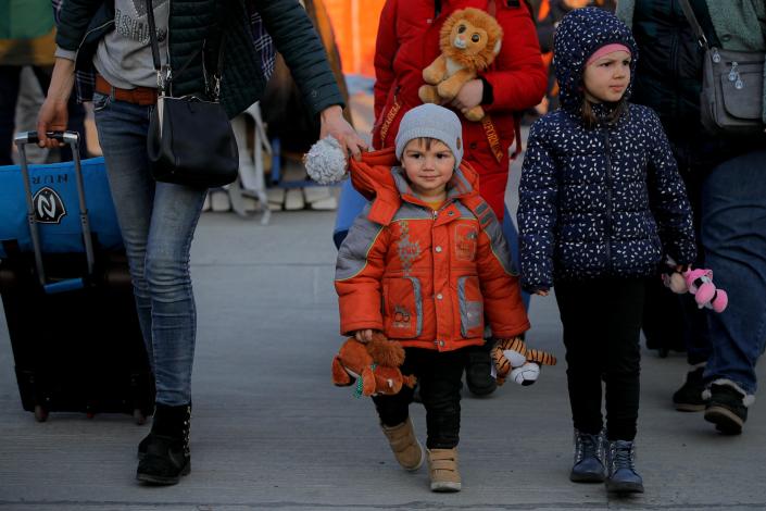 Children who fled the war in Ukraine entering Romania (Andreea Alexandru/AP)