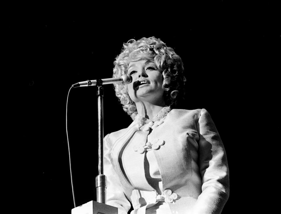 Dolly Parton performs at an event marking the 44th anniversary of the Grand Ole Opry in 1969. Parton made her Opry debut in 1959 at age 13.