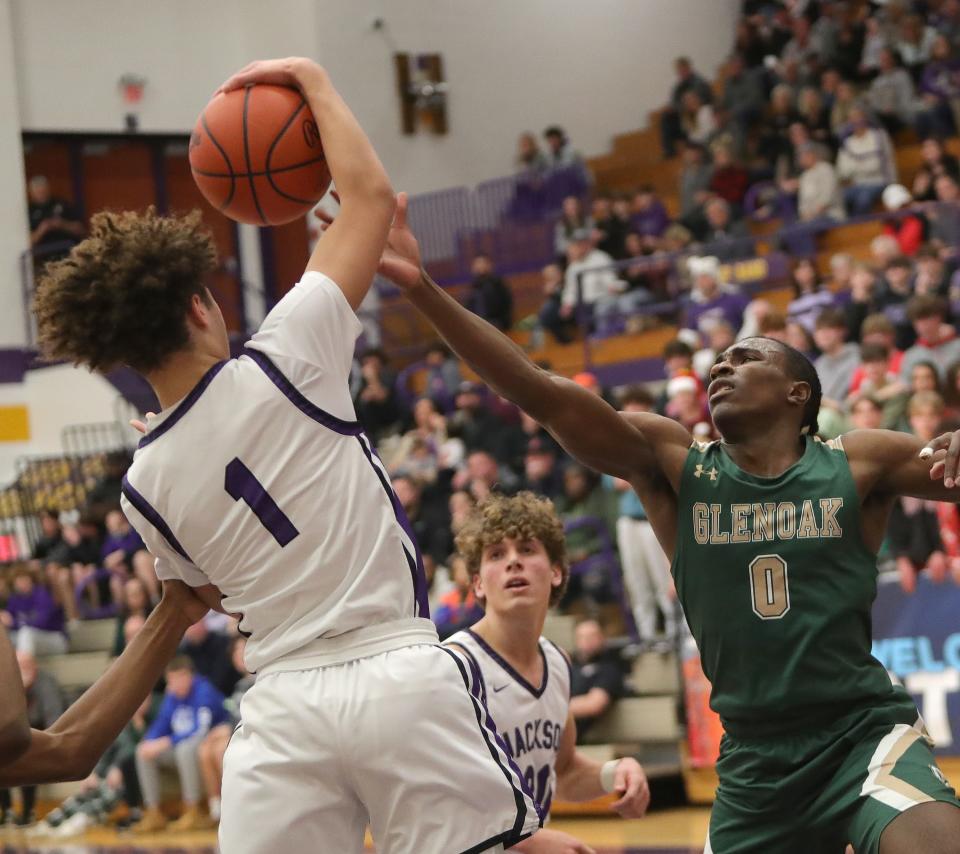 Ja'Corey Lipkins (right), shown here during a game against Jackson last week, scored 18 points in GlenOak's win over Bishop Ready on Thursday.