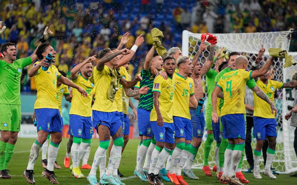 Brazil celebrate/World Cup 2022 schedule: Match dates, times, group stages and results - AP/ARIEL SHALITY