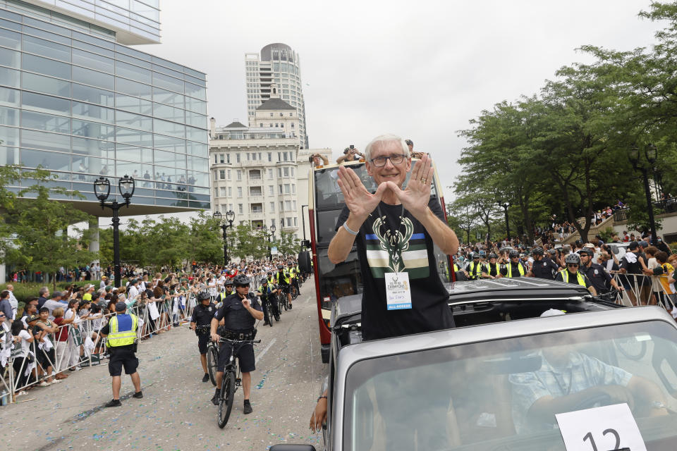 Wisconsin Governor Tony Evers takes part in parade for the NBA Champion Milwaukee Bucks basketball team Thursday, July 22, 2021, in Milwaukee. (AP Photo/Jeffrey Phelps)