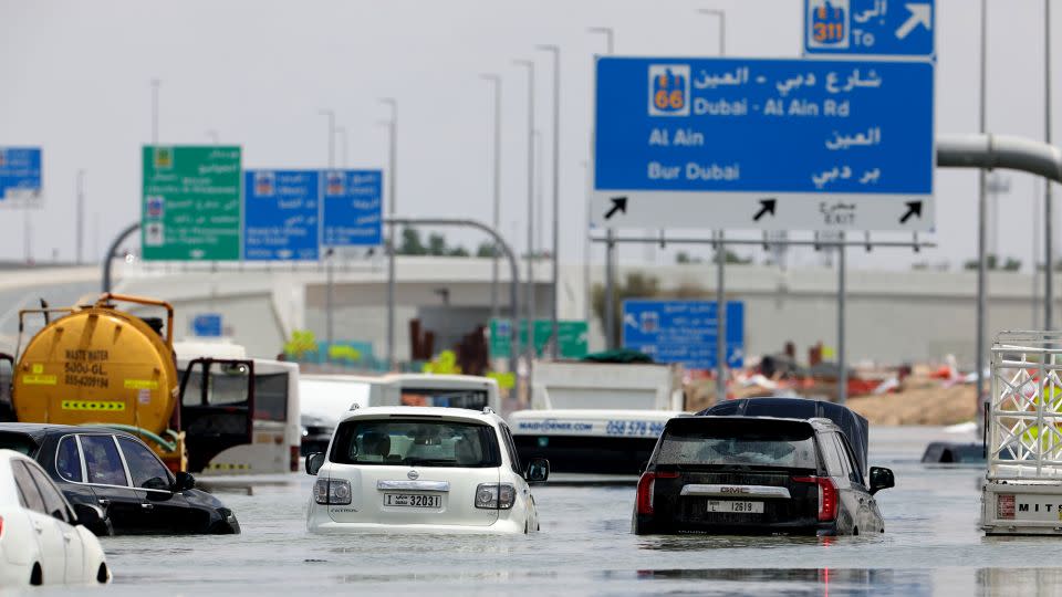 Abandoned vehicles on a flooded highway after a rainstorm in Dubai, United Arab Emirates on Wednesday. - Christopher Pike/Bloomberg/Getty Images
