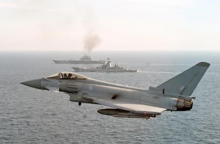 A RAF Typhoon monitors Russian warships Pyotr Velikiy and the Admiral Kuznetsov (rear) as they pass close to UK territorial waters. Ministry of Defence/Crown Copyright 2017/Handout via REUTERS