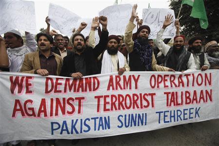 Supporters of Pakistan's religious political party Sunni Tehreek shout slogans as they demand a military operation against Taliban, in Pakistan's northwest, during a protest rally in Lahore February 28, 2014. REUTERS/Mohsin Raza