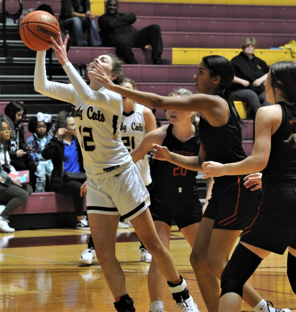 Canadian's Briley Merket pushes past Anson defenders for the basket on Saturday, November 27, 2021 at MSU.