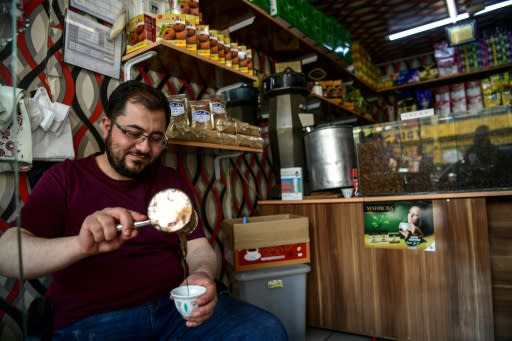 A Syrian coffee seller pours the black liquid in the Turkish city of Gaziantep, home to around half a million Syrians who fled the civil war south of the border