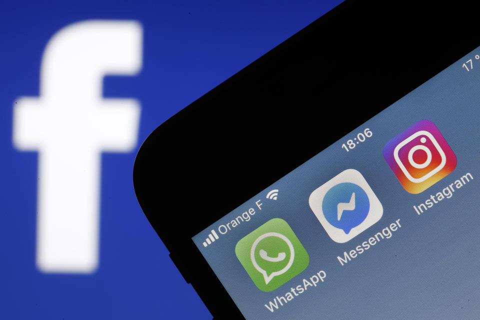 PARIS, FRANCE - JANUARY 28: In this photo illustration, the logos of the messaging applications, WhatsApp, Messenger and Instagram are displayed on the screen of an Apple iPhone in front of a computer screen displaying a Facebook logo on January 28, 2019 in Paris, France. The big new project of Mark Zuckerberg, founder of social network Facebook is to unify all its messaging applications according to the New York Times. So all the applications of Facebook, Messenger, Instagram and WhatsApp, could work together, the exchanged messages would be encrypted as they are currently on WhatsApp. 'We are working to ensure that more of our messaging is encrypted end-to-end and we are thinking of ways to make it easier to communicate with family and friends via all networks,' said a Facebook spokesman, confirming news reports from New York Times. Facebook's three messaging services each claim more than one billion users worldwide. (Photo by Chesnot/Getty Images)