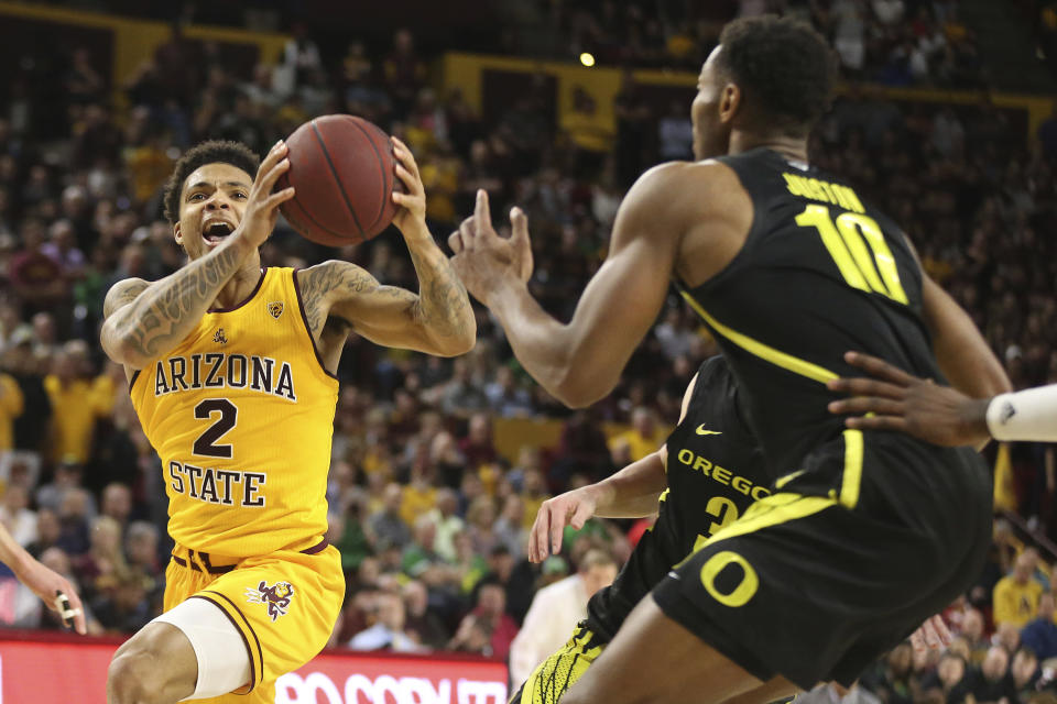 Arizona State's Rob Edwards (2) drives to the basket against Oregon's Shakur Juiston (10) during the second half of an NCAA college basketball game Thursday, Feb. 20, 2020, in Tempe, Ariz. (AP Photo/Darryl Webb)
