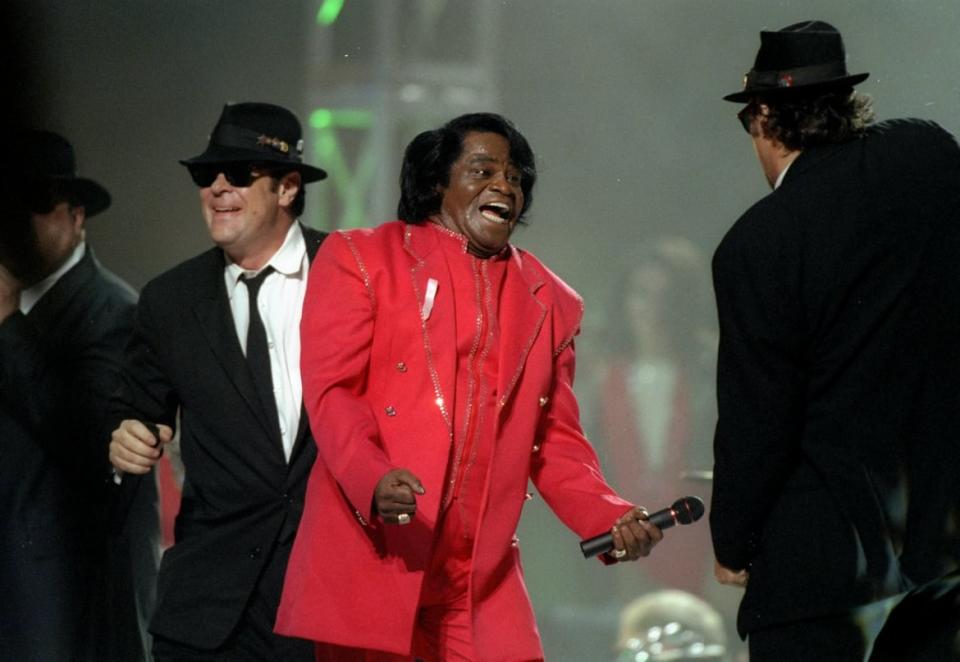 <div class="inline-image__caption"><p>Dan Aykroyd, James Brown, and James Belushi perform during the half-time show for Super Bowl XXXI between the New England Patriots and the Green Bay Packers at the Superdome in New Orleans, Louisiana, in 1997.</p></div> <div class="inline-image__credit">Doug Pensinger/Getty</div>