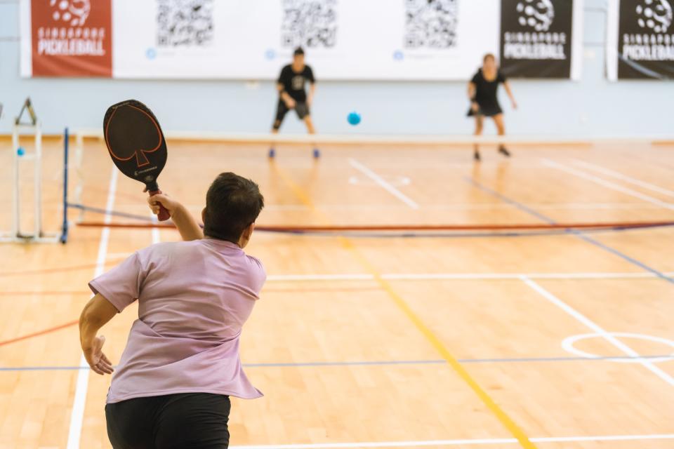 A pickleball player serves the ball at the Singapore Pickleball Open. (PHOTO: Singapore Pickleball )