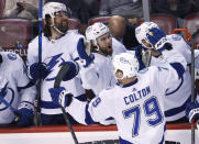 Tampa Bay Lightning center Ross Colton (79) is congratulated after scoring agains the Florida Panthers in the closing seconds of Game 2 of an NHL hockey second-round playoff series Thursday, May 19, 2022, in Sunrise, Fla. (AP Photo/Reinhold Matay)