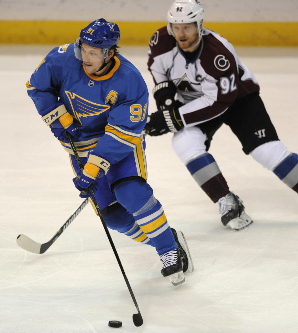 St. Louis Blues' Vladimir Tarasenko (91), of Russia, skates by Colorado Avalanche's Gabriel Landeskog (92), of Sweden, during the third period of an NHL hockey game, Sunday, April 9, 2017, in St. Louis. The Blues won 3-2. (AP Photo/Bill Boyce)