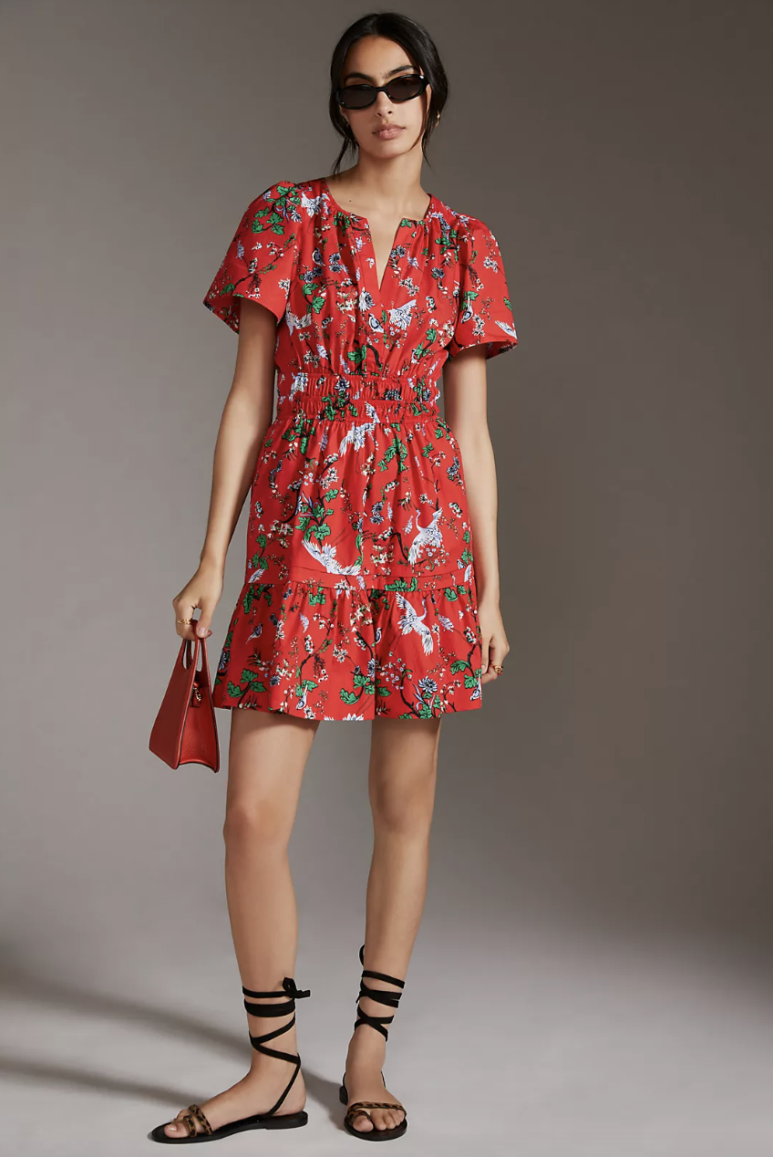 model in black sandals, sunglasses and red printed dress, The Somerset Mini Dress in Red Motif (Photo via Anthropologie)