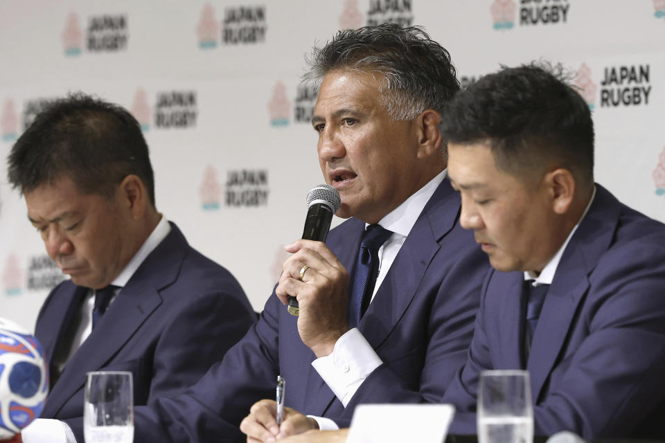 Japan coach Jamie Joseph, center, speaks during a press conference as he named his squad on Tuesday, Aug. 15, 2023, for rugby’s upcoming World Cup in France. (Kyodo News via AP)