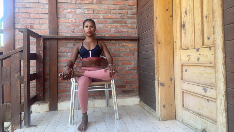 Aysha Bell doing the seated modified pigeon pose