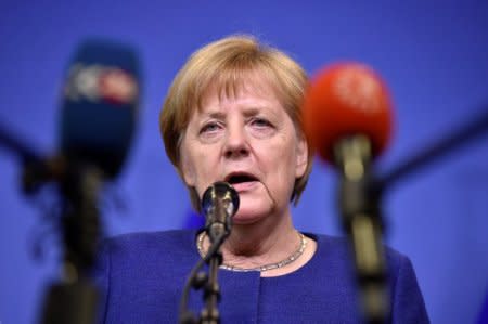 German Chancellor Angela Merkel talks to the press after an emergency European Union leaders summit on immigration at the EU Commission headquarters in Brussels, Belgium June 24, 2018. REUTERS/Eric Vidal