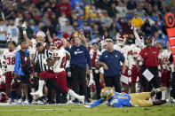 Fresno State running back Ronnie Rivers (20) runs past UCLA defensive back DJ Warnell (14) to score a rushing touchdown during the first half of an NCAA college football game Saturday, Sept. 18, 2021, in Pasadena, Calif. (AP Photo/Marcio Jose Sanchez)