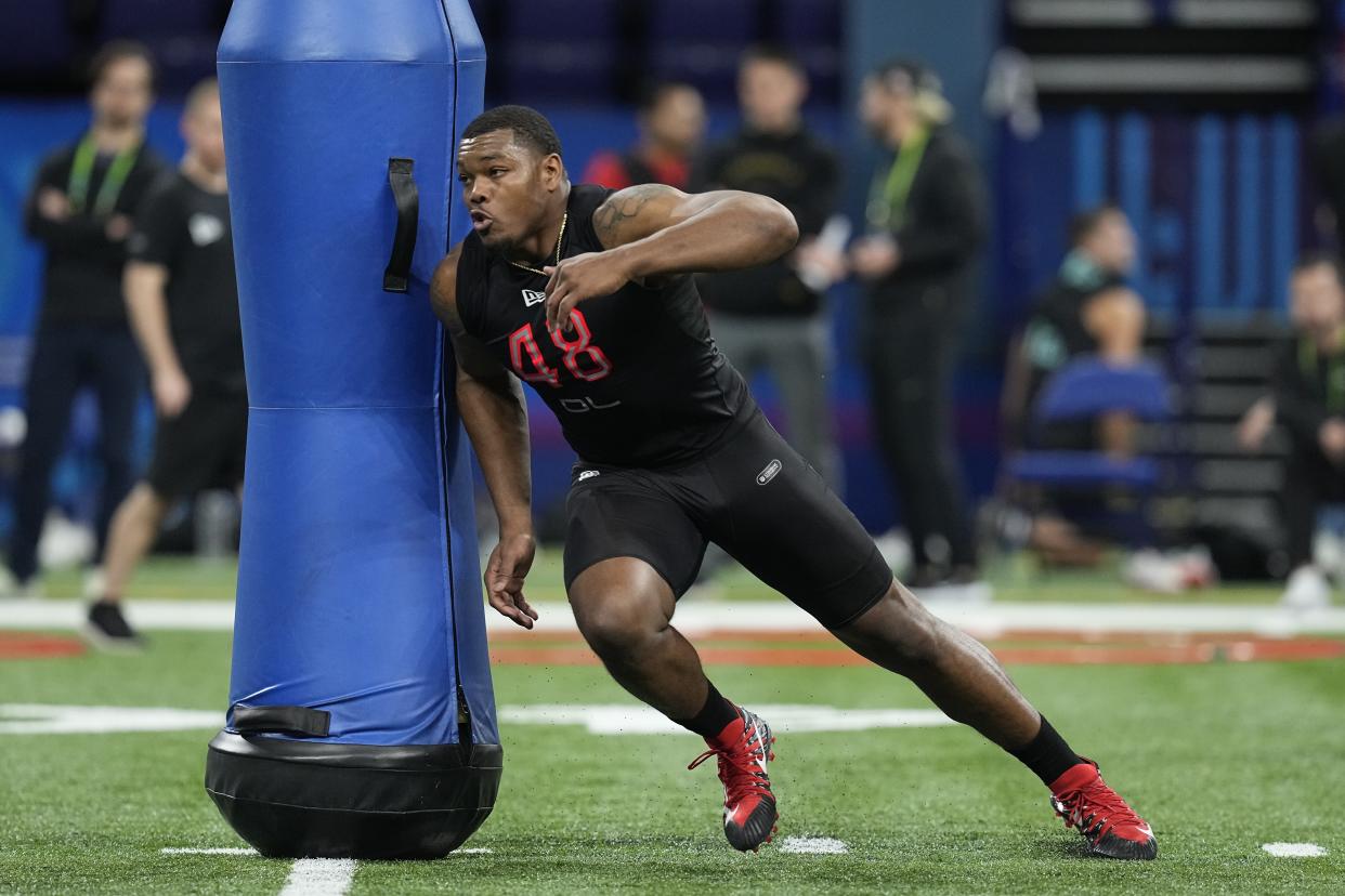 Georgia defensive lineman Travon Walker runs a drill during the NFL football scouting combine, Saturday, March 5, 2022, in Indianapolis. (AP Photo/Darron Cummings)