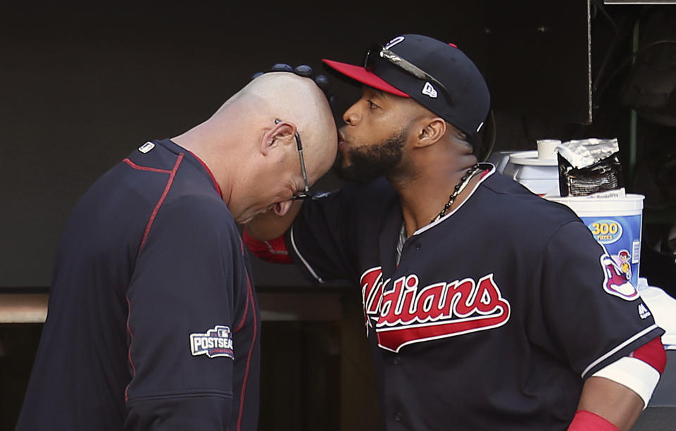 FILE - Cleveland Indians' Carlos Santana, right, kisses manager Terry Francona's head before Game 2 of baseball's American League Division Series against the Boston Red Sox, Friday, Oct. 7, 2016, in Cleveland. Slowed by major health issues in recent years, the personable, popular Francona may be stepping away, but not before leaving a lasting imprint as a manager and as one of the game's most beloved figures. (AP Photo/Aaron Josefczyk, File)