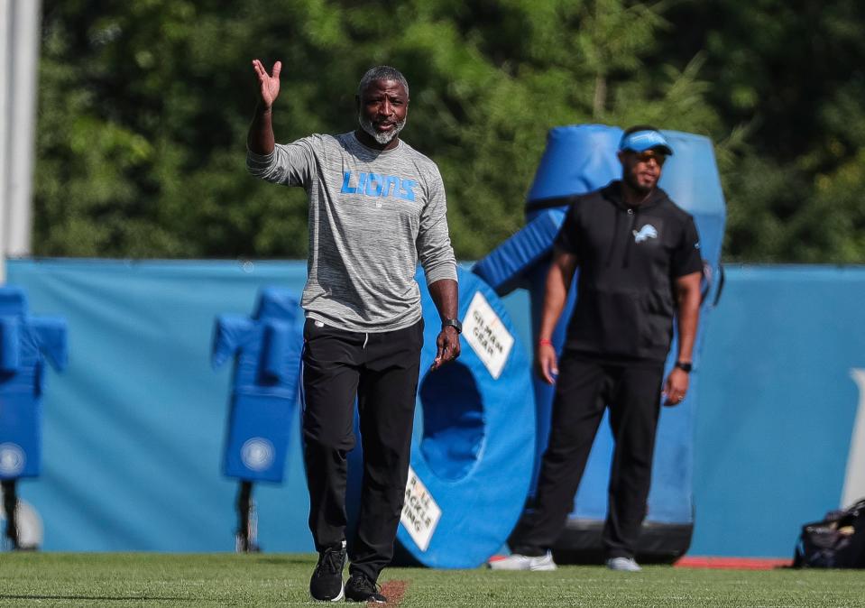 Detroit Lions defensive coordinator Aaron Glenn talks to coaches during the joint practice with New York Giants at Detroit Lions headquarters and training facility in Allen Park on Wednesday, August 9, 2023.