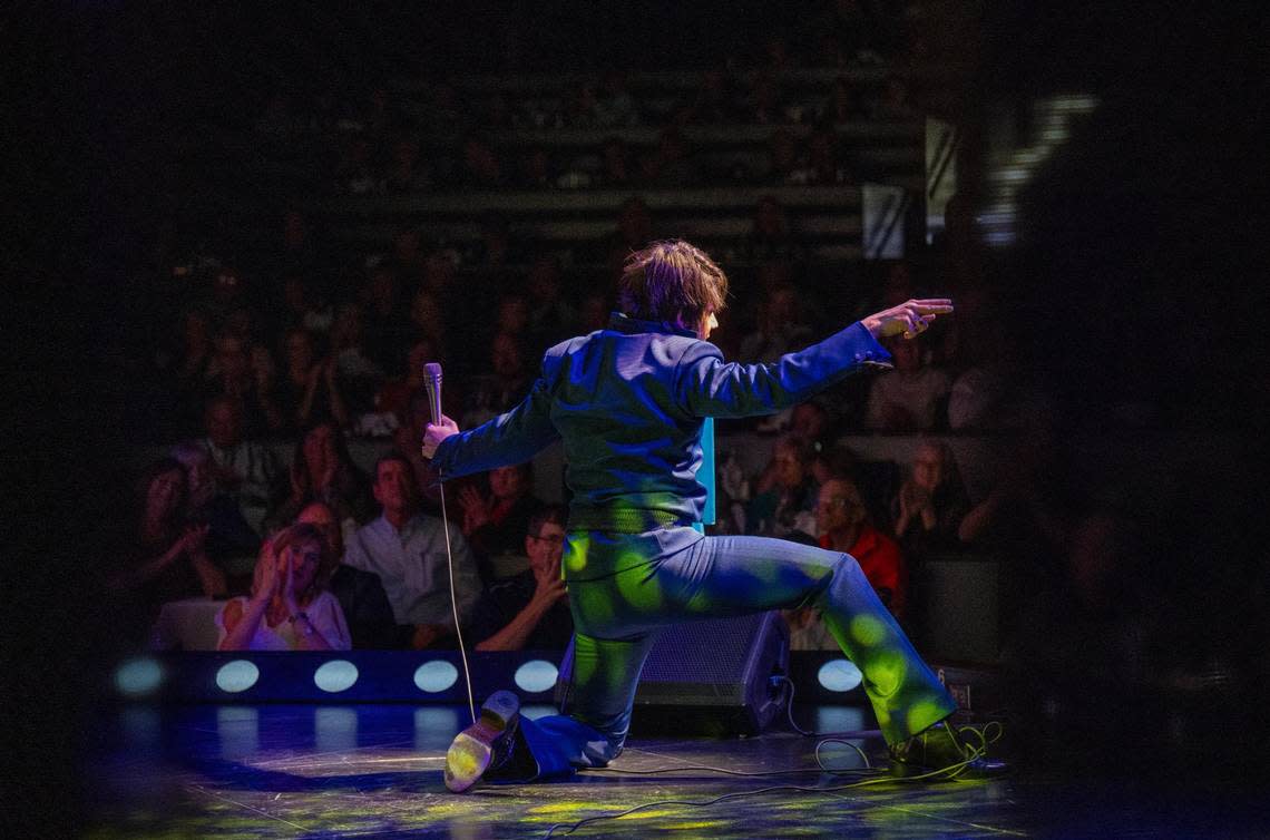 Seen from stage right, Trevino performs the physically demanding moves to channel the persona of Elvis on stage.