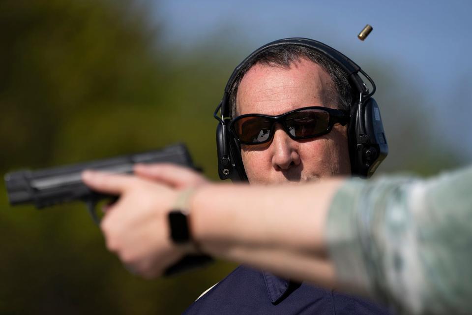 May 6, 2023; Medina, Ohio, USA; Jim Irvine gives instruction during the range instruction part of a concealed carry course. Trainees are required three hours of instruction on the range.