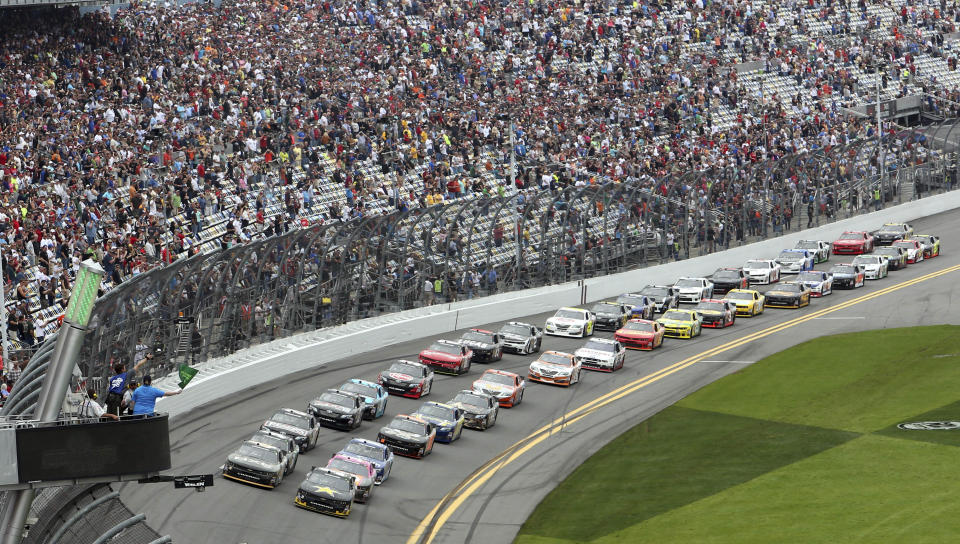 The field takes the green flag to start the NASCAR Nationwide series auto race at Daytona International Speedway in Daytona Beach, Fla., Saturday, Feb. 22, 2014. (AP Photo/David Graham)