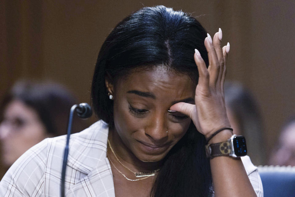 United States Olympic gymnast Simone Biles testifies during a Senate Judiciary hearing about the Inspector General's report on the FBI's handling of the Larry Nassar investigation on Capitol Hill, Wednesday, Sept. 15, 2021, in Washington. Nassar was charged in 2016 with federal child pornography offenses and sexual abuse charges in Michigan. He is now serving decades in prison after hundreds of girls and women said he sexually abused them under the guise of medical treatment when he worked for Michigan State and Indiana-based USA Gymnastics, which trains Olympians. (Graeme Jennings/Pool via AP)