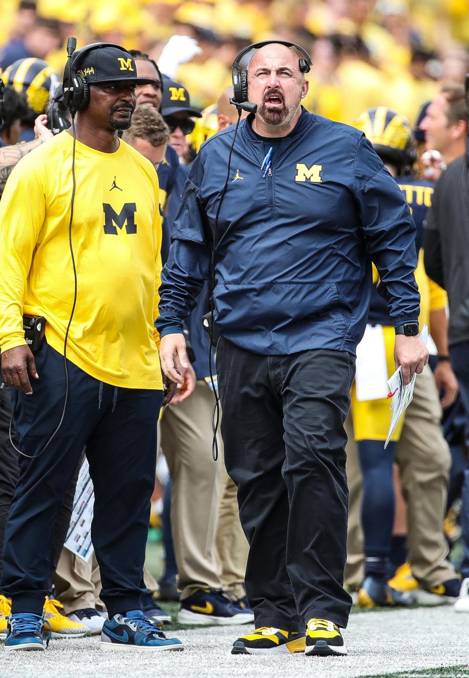Michigan linebackers coach Chris Partridge watches a play during the second half of U-M's 30-3 win on Saturday, Sept. 2, 2023, at Michigan Stadium.
