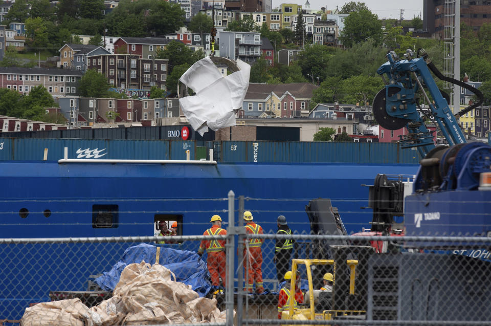 Debris from the Titan submersible, recovered from the ocean floor near the wreck of the Titanic, is unloaded from the ship Horizon Arctic at the Canadian Coast Guard pier in St. John's, Newfoundland on Wednesday, June 28, 2023. (Paul Daly/The Canadian Press via AP)