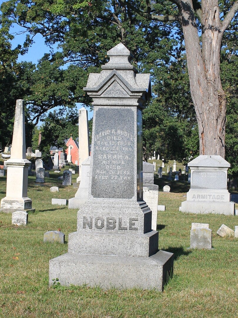 This is the marker for David Addison Noble at Monroe’s Woodland Cemetery. Noble was Monroe’s mayor in 1852 and also served as prosecuting attorney and probate judge in Monroe and as a Michigan and U.S. representative. His wife is said to have coined the phrase “Floral City” for an 1852 event sponsored by the Michigan Southern and Northern Indiana Railroad.