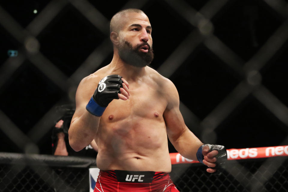 Sep 9, 2023; Sydney, NSW, AUSTRALIA; John Makdessi (blue gloves) fights Jamie Mullarkey (not pictured) during UFC 293 at Qudos Bank Arena. Mandatory Credit: Jasmin Frank-USA TODAY Sports