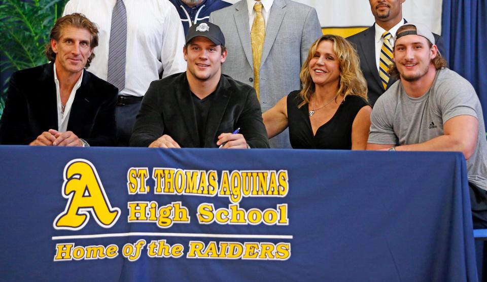 Nick Bosa commits to Ohio State with his family; father John Bosa, Nick, mother Cherly and Joey, who plays for Ohio State, on National Signing Day at Saint Thomas Aquinas High School in Fort Lauderdale, Fl, Feb. 3, 2016