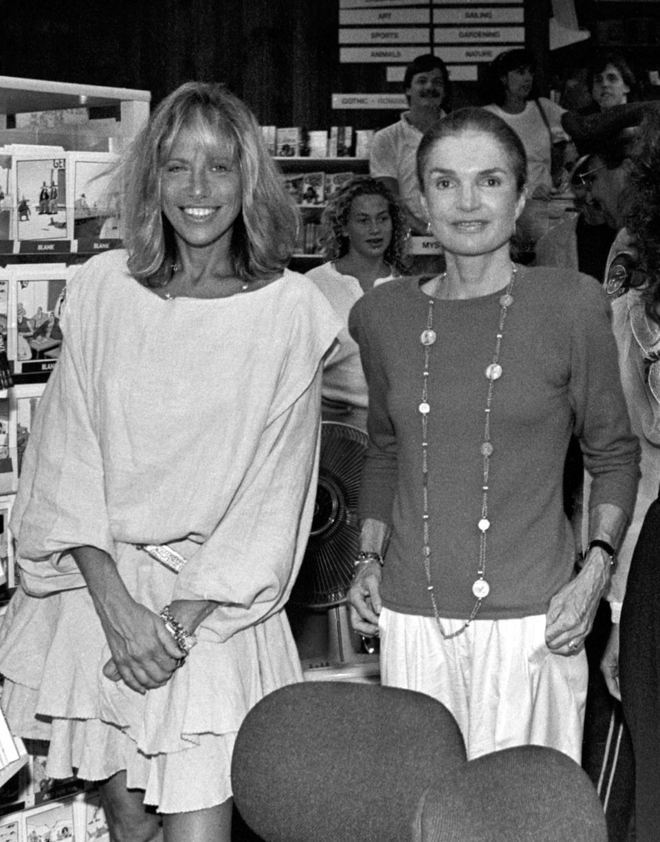 Good friends Carly Simon and Jackie Onassis pose for a picture at Bunch of Grapes Bookstore on Martha's Vineyard, Massachusetts, 9/2/89.   Photo by Stephen Rose   (Photo by Stephen Rose/Getty Images)