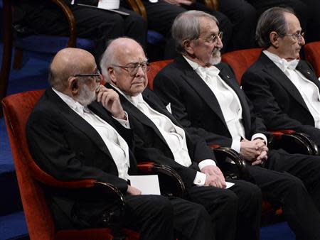 Nobel prize laureates (L-R) Francois Englert and Peter Higgs in Physics sit with Martin Karplus and Michael Levitt in Chemistry during the 2013 Nobel Prize award ceremony in Stockholm December 10, 2013. REUTERS/Claudio Bresciani
