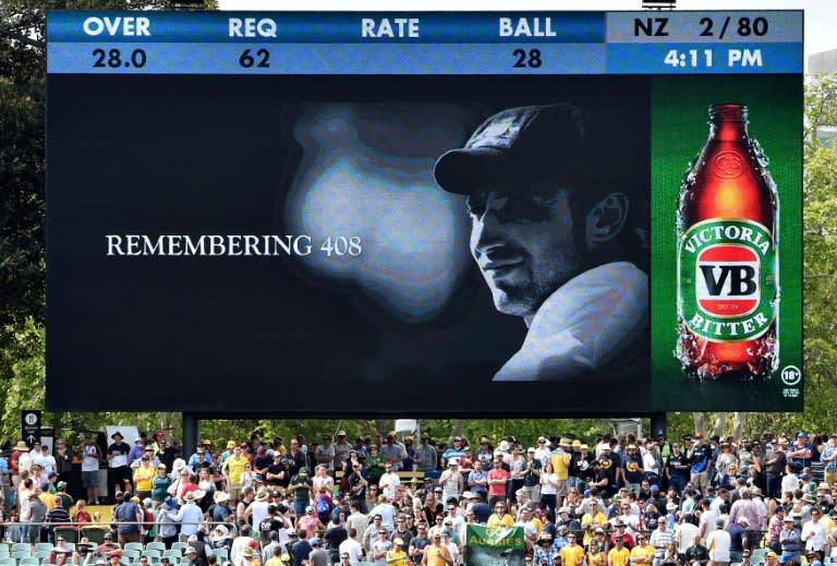 Spectators pay their respects to the late Phillip Hughes during the first day-night Test match, between Australia and New Zealand, at the Adelaide Oval, on November 27, 2015