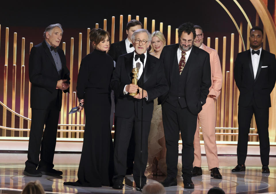 This image released by NBC shows Judd Hirsch, from left, Kristie Macosko Krieger, Paul Dano, Steven Spielberg, Michelle Williams, Tony Kushner and Seth Rogen accepting the award for Best Motion Picture – Drama for "The Fabelmans" during the 80th Annual Golden Globe Awards at the Beverly Hilton Hotel on Tuesday, Jan. 10, 2023, in Beverly Hills, Calif. (Rich Polk/NBC via AP)