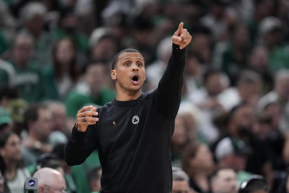 Boston Celtics coach Joe Mazzulla calls to players during the first half of Game 1 of the basketball team's NBA Finals against the Dallas Mavericks, Thursday, June 6, 2024, in Boston. (AP Photo/Charles Krupa)