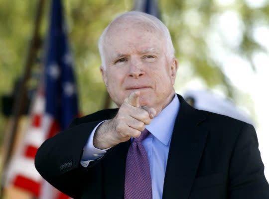 Sen. John McCain, R-Ariz, acknowledges a fellow Navy veteran during a Phoenix Memorial Day Ceremony, May 30, 2016. (Photo: Ralph Freso/AP)