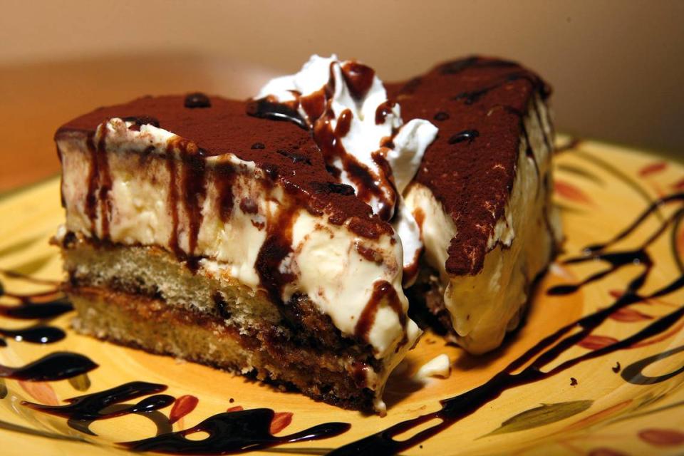 The already decadent tiramisu comes with a drizzle of chocolate syrup.