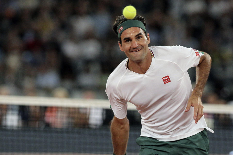 Roger Federer in action during the exhibition tennis match against Rafael Nadal held at the Cape Town Stadium in Cape Town, South Africa, Friday Feb. 7, 2020. (AP Photo/Halden Krog)