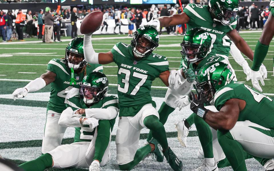 Oct 15, 2023; East Rutherford, New Jersey, USA; New York Jets cornerback Bryce Hall (37) celebrates with teammates after an interception during the second half against the Philadelphia Eagles at MetLife Stadium. Mandatory Credit: Vincent Carchietta-USA TODAY Sports