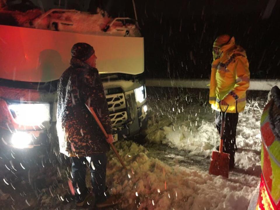 <p>Picture taken from the Twitter feed of Gloucestershire Constabulary of police at the scene of a lorry that jack-knifed on the M5 Junction 11A after wintry weather swept across the country. (PA) </p>