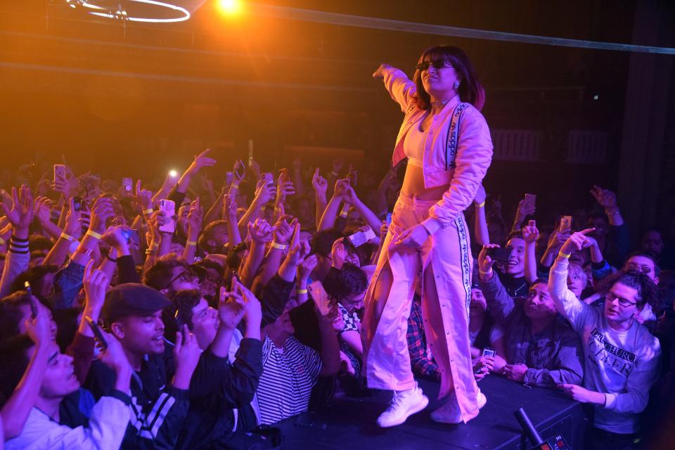 Charli XCX performing in 2019