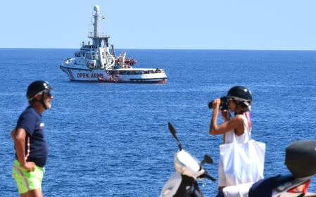 Spanish migrant rescue ship Open Arms is seen close to the Italian shore in Lampedusa
