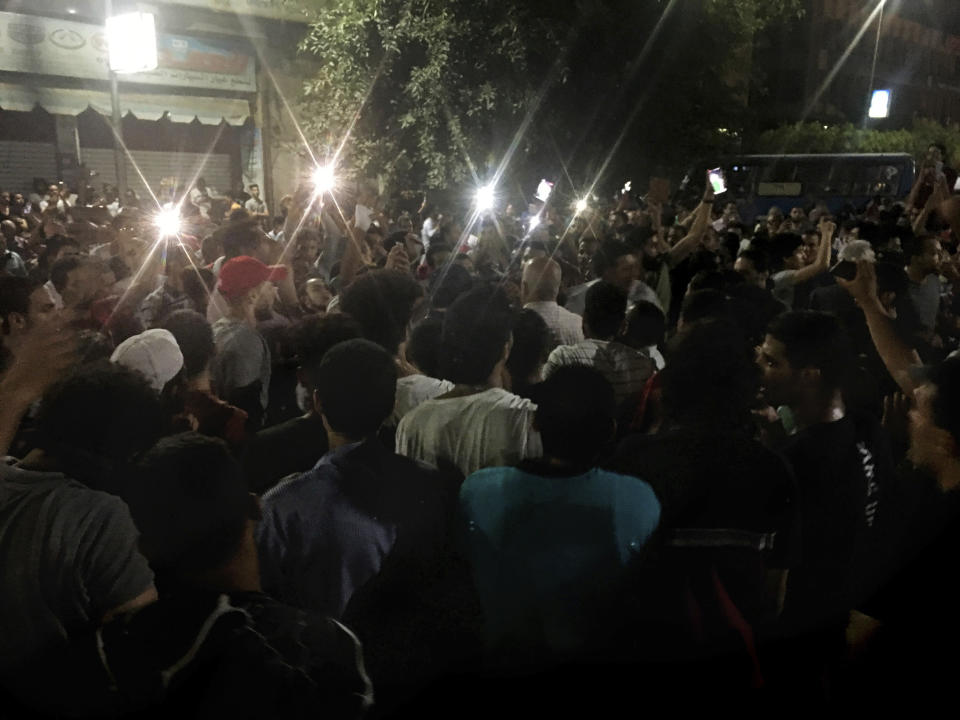 Protesters chant slogans against the regime in Cairo, Egypt, early Saturday, Sept. 21, 2019. Dozens of people held a rare protest in Cairo during which they called on Egyptian President Abdel-Fattah el-Sissi to quit. Security forces dispersed the protesters and no casualties were reported. (AP Photo/Nariman El-Mofty)