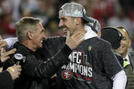 San Francisco 49ers head coach Kyle Shanahan celebrates with his dad, Mike, after the NFL NFC Championship football game against the Green Bay Packers Sunday, Jan. 19, 2020, in Santa Clara, Calif. The 49ers won 37-20 to advance to Super Bowl 54 against the Kansas City Chiefs. (AP Photo/Matt York)