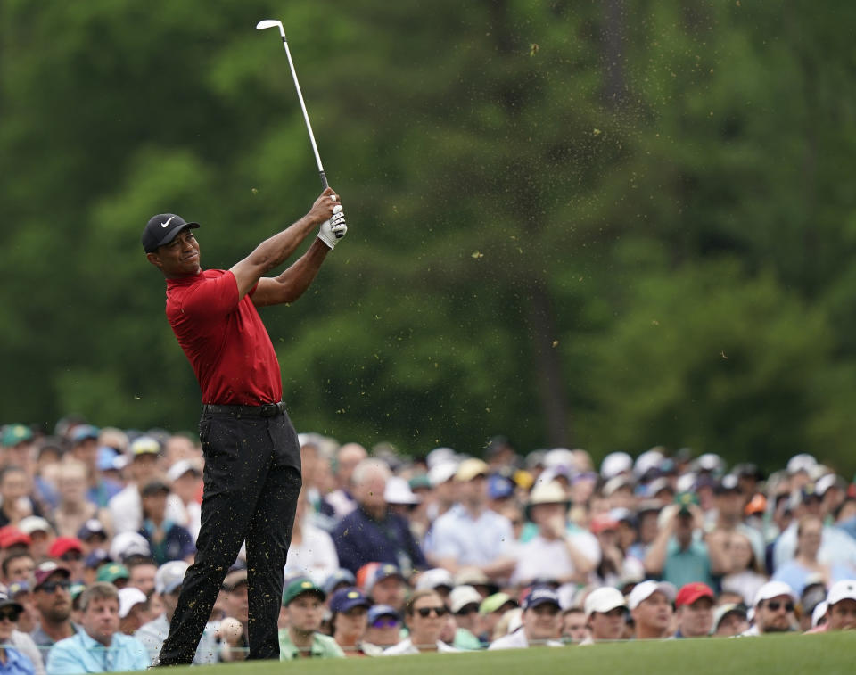 FILE - Tiger Woods hits on the 12th hole during the final round for the Masters golf tournament, Sunday, April 14, 2019, in Augusta, Ga. Woods leaned on experience over shots like this to help him win the Masters for the fifth time. (AP Photo/David J. Phillip)